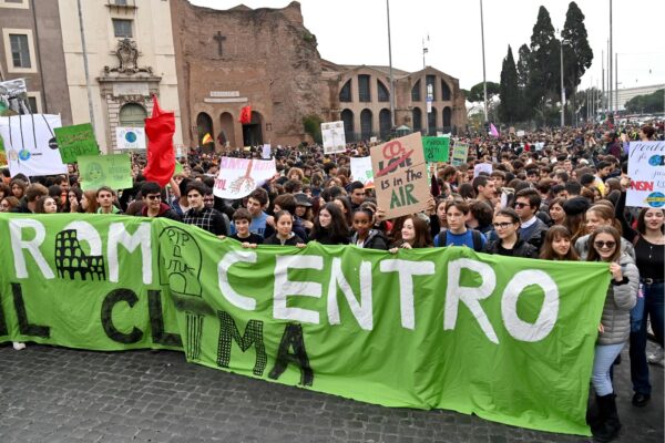 Students hold a banner and placards during a demonstration as part of the Fridays for Future movement for climate change, on November 29, 2019 in Rome. (Photo by ANDREAS SOLARO / AFP)