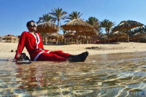 A Lebanese freediver wearing a Father Christmas (Saint Nicholas or Santa Claus) poses along the water off the coast of the northern city of Batroun on December 19, 2019. (Photo by Ibrahim CHALHOUB / AFP)