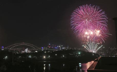 Fireworks explode around the Sydney Opera House and Harbour Bridge as New Year’s celebrations get underway in Sydney, Australia, Saturday, Dec. 31, 2016. (ANSA/AP Photo/Rick Rycroft) [CopyrightNotice: Copyright 2016 The Associated Press. All rights reserved.]