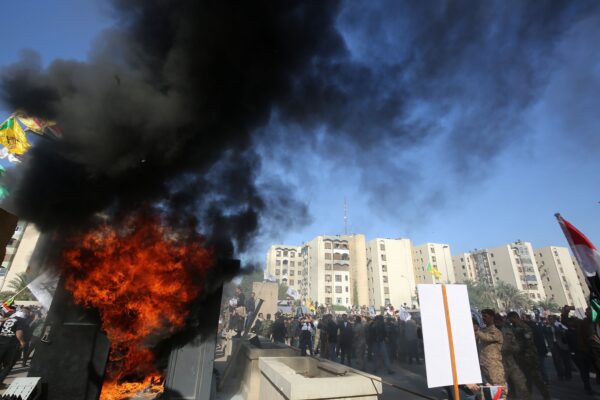 Iraqi protesters set ablaze a sentry box in front of the US embassy building in the capital Baghdad to protest against the weekend’s air strikes by US planes on several bases belonging to the Hezbollah brigades near Al-Qaim, an Iraqi district bordering Syria, on December 31, 2019. – Several thousand Iraqi protesters attacked the US embassy in Baghdad on today, breaching its outer wall and chanting "Death to America!" in anger over weekend air strikes that killed pro-Iran fighters. (Photo by Ahmad AL-RUBAYE / AFP)