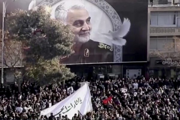 In this image made from a video, mourners gather to pay their respects to the slain Gen. Qassem Soleimani who was killed in a U.S. airstrike, in Kerman, Iran Tuesday, Jan. 7, 2020. (Iran Press via AP)