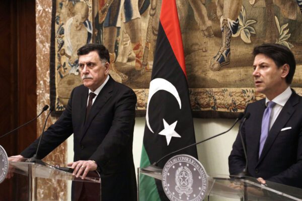 Libya’s Prime Minister Fayez al-Sarraj, left, holds a joint press conference with Italian Premier Giuseppe Conte after their meeting at Chigi palace, in Rome, Saturday, Jan. 11, 2020. (AP Photo/Gregorio Borgia)