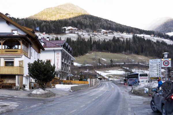 General view on a street where a car had plowed into a group of people in Luttach, near Bruneck in the northern region South Tirol, Italy, Sunday, Germany, Jan. 5, 2020. Italian fire officials say a car crashed into a group of young German tourists in northern Italy, killing at least six people and injuring eleven. (AP Photo/Helmut Moling)