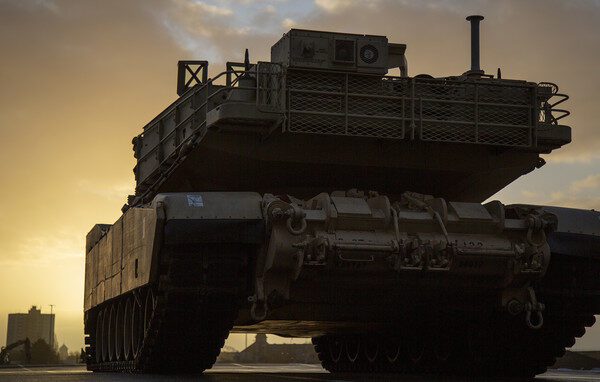 An M1A1 Abrams tank offloaded for DEFENDER-Europe 20 from the M/V Endurance, a contracted roll on, roll off vessel through Military Sealift Command, sits prepositioned on the pier at Bremerhaven port. Endurance transited more than 14,825 long tons of cargo equaling 1,254 pieces of equipment across the Atlantic for DEFENDER-Europe 20. DEFENDER-Europe 20 demonstrates and develops the extensive military capabilities that NATO allies need to prevent conflict, preserve peace and keep our nations safe.