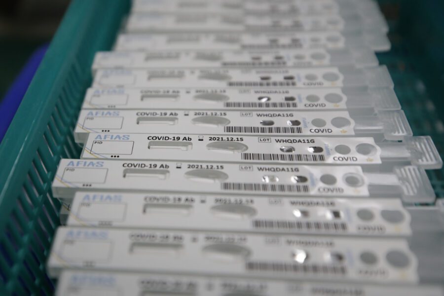Antibody test cartridges of AFIAS COVID-19 Ab testing kit used in diagnosing the coronavirus move on a production line of the Boditech Med Inc. in Chuncheon, South Korea, Friday, April 17, 2020. Boditech Med recently started exporting its antibody-based virus test kits to various countries. (AP Photo/Lee Jin-man)