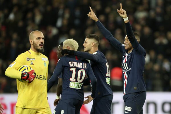 PSG’s Kylian Mbappe, right, celebrates after scoring his side 6th goal, as Saint Etienne’s goal keeper Jessy Moulin, left, looks on, during the French League Cup quarter final soccer match between Paris Saint Germain and Saint Etienne at the Parc des Princes stadium in Paris, Wednesday, Jan. 8, 2020. (AP Photo/Thibault Camus)