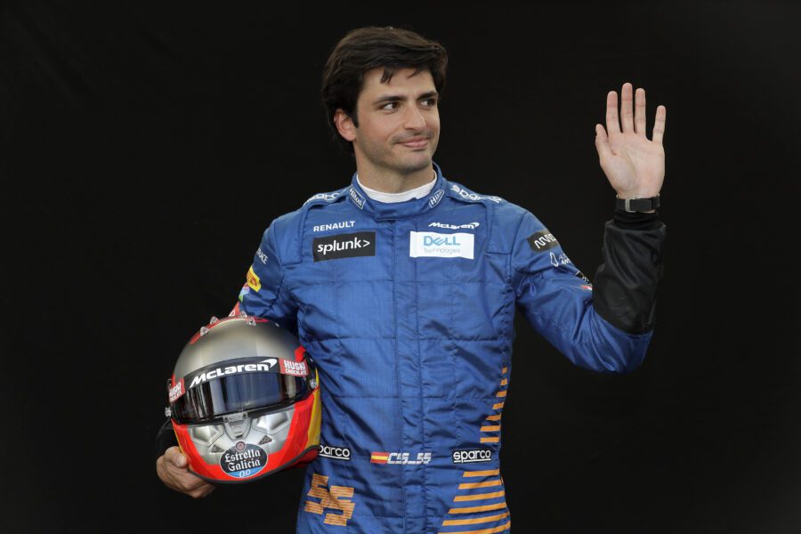 McLaren driver Carlos Sainz of Spain waves as he poses for a photo at the Australian Formula One Grand Prix in Melbourne, Thursday, March 12, 2020. (AP Photo/Rick Rycroft)