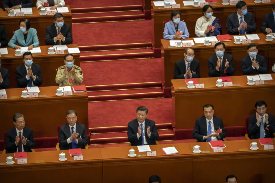 Chinese President Xi Jinping, center, applauds after the passage of a piece of national security legislation concerning Hong Kong during the closing session of China’s National People’s Congress (NPC) in Beijing, Thursday, May 28, 2020. China’s ceremonial legislature has endorsed a national security law for Hong Kong that has strained relations with the United States and Britain. (AP Photo/Mark Schiefelbein)