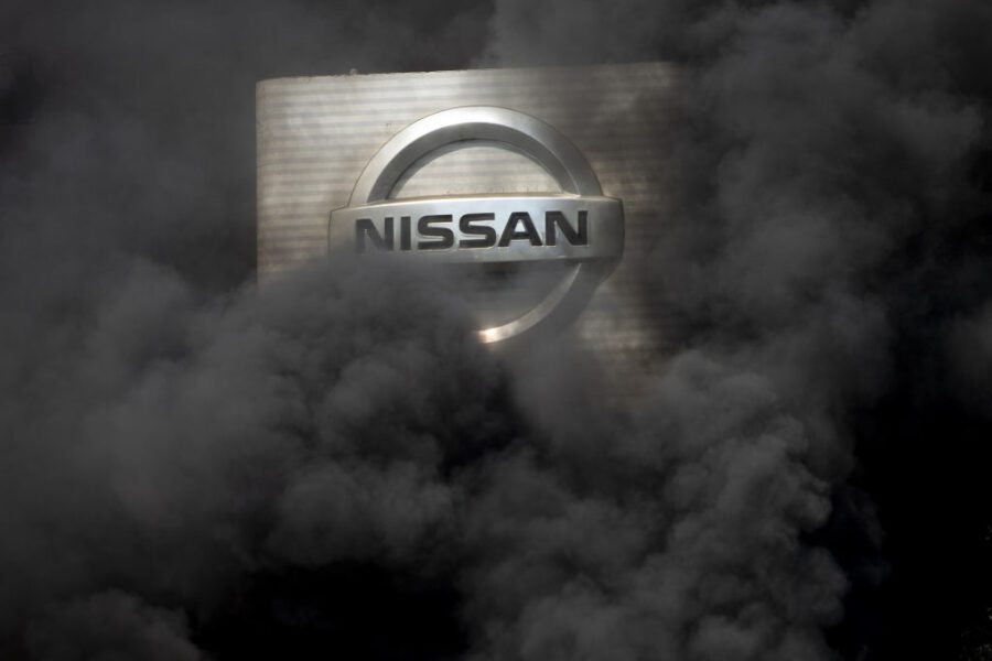 BARCELONA, SPAIN – MAY 28: The logo of Nissan is covered by smoke columns as employees burn tyres to protest against the closure of the Japanese cars manufacturer’s plant, where about 3,000 people are employed,  in Barcelona, Spain on May 28, 2020. (Photo by ADRIA PUIG/Anadolu Agency via Getty Images)