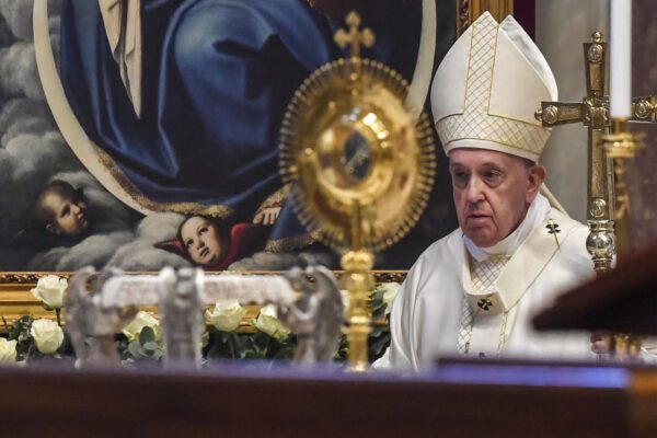 Pope Francis leaves after celebrating the Corpus Domini Mass, inside St. Peter’s Basilica at the Vatican Sunday, June 14, 2020.  (Tiziana Fabi/Pool Photo via AP)