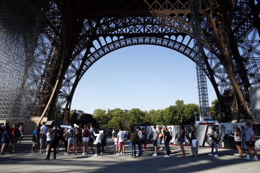 People queue up prior to visit the Eiffel Tower, in Paris, Thursday, June 25, 2020. The Eiffel Tower reopens after the coronavirus pandemic led to the iconic Paris landmark’s longest closure since World War II. (AP Photo/Thibault Camus)