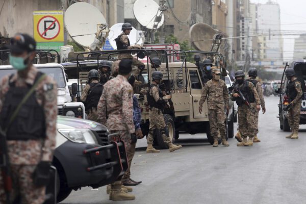 Security personnel surround the Stock Exchange Building after gunmen’s attack in Karachi, Pakistan, Monday, June 29, 2020. Special police forces deployed to the scene of the attack and in a swift operation secured the building. (AP Photo/Fareed Khan)