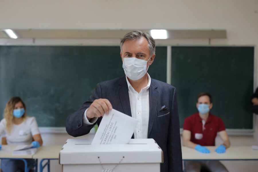 Miroslav Skoro’s, leader of the Homeland Movement casts his ballot at a polling station in Zagreb, Croatia, Sunday, July 5, 2020. Amid a spike of new coronavirus cases, voters in Croatia cast ballots on Sunday in what is expected be a close parliamentary race that could push the latest European Union member state further to the right. (Antonio Bronic/Pool Photo via AP)