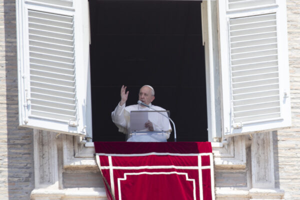 Pope Francis delivers his blessing to faithful during the Angelus prayer from the window of his studio overlooking St. Peter’s Square at the Vatican, Sunday, July 12, 2020. (AP Photo/Alessandra Tarantino)