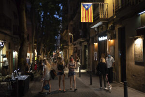 People walk at night in Gracia neighborhood in Barcelona, Spain, Friday, July 24, 2020. Health authorities in the northeastern region of Catalonia have ordered nightclubs to be fully closed and bars and restaurant in Barcelona to shut down by midnight in an effort to stem the spread of the new coronavirus. (AP Photo/Felipe Dana) People walk at night in Gracia neighborhood in Barcelona, Spain, Friday, July 24, 2020. Health authorities in the northeastern region of Catalonia have ordered nightclubs to be fully closed and bars and restaurant in Barcelona to shut down by midnight in an effort to stem the spread of the new coronavirus. (AP Photo/Felipe Dana)