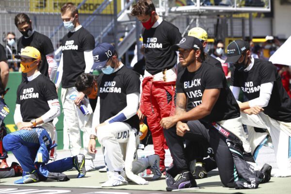 Drivers take a knee n support of the Black Lives Matter movement before the Austrian Formula One Grand Prix race at the Red Bull Ring racetrack in Spielberg, Austria, Sunday, July 5, 2020. (Dan Istitene/Pool via AP)