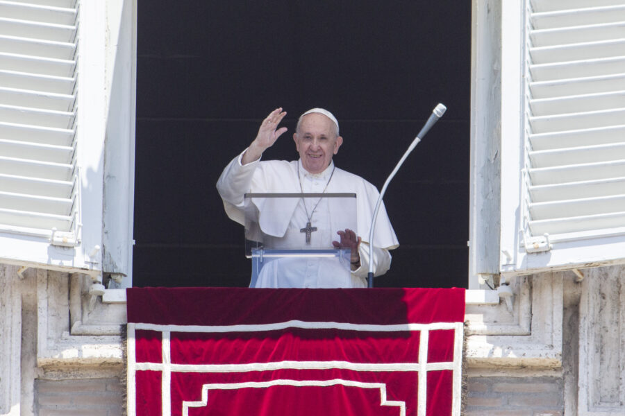 Pope Francis waves to the faithful from the window of his studio overlooking St. Peter’s Square at the Vatican, Sunday, June 28, 2020. (AP Photo/Riccardo De Luca)