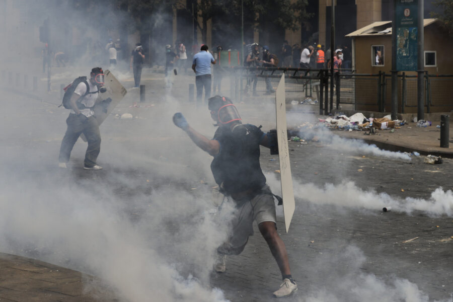 People clash with police during a protest against the political elites and the government after this week’s deadly explosion at Beirut port which devastated large parts of the capital and killed more than 150 people, in Beirut, Lebanon, Saturday, Aug. 8, 2020. (AP Photo/Hassan Ammar)