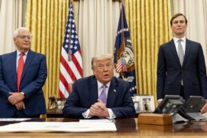President Donald Trump, center, accompanied by U.S. Ambassador to Israel David Friedman, left, and Trump’s White House senior adviser Jared Kushner, right, speaks in the Oval Office at the White House, Wednesday, Aug. 12, 2020, in Washington. Trump said on Thursday that the United Arab Emirates and Israel have agreed to establish full diplomatic ties as part of a deal to halt the annexation of occupied land sought by the Palestinians for their future state. (AP Photo/Andrew Harnik)