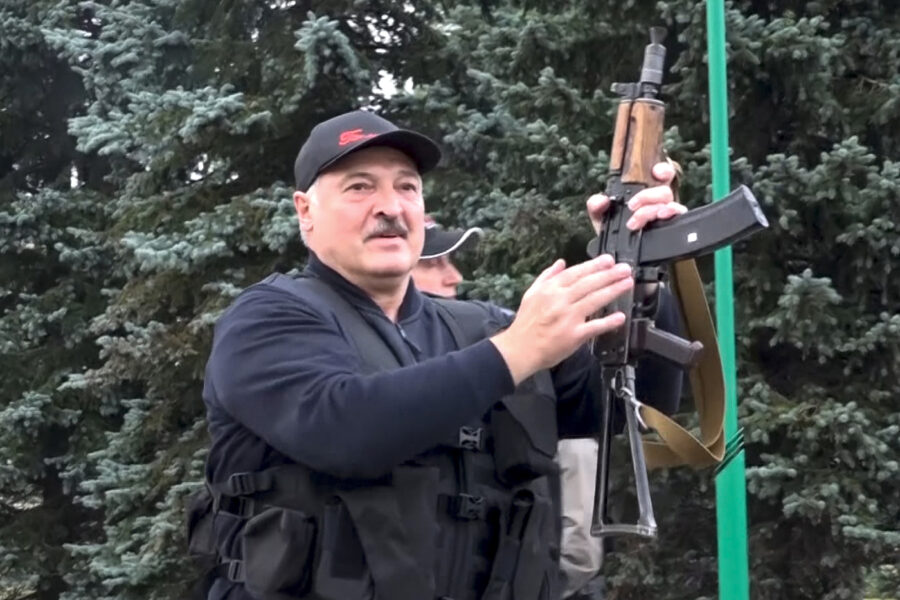 This image made from video provided by the State TV and Radio Company of Belarus, shows Belarus President Alexander Lukashenko armed with a Kalashnikov-type rifle near the Palace of Independence in Minsk, Belarus, Sunday, Aug. 23, 2020. Lukashenko has made a dramatic show of defiance against the massive protests demanding his resignation, toting a rifle and wearing a bulletproof vest as he strode off a helicopter that landed at his residence while demonstrators massed nearby. (State TV and Radio Company of Belarus via AP)