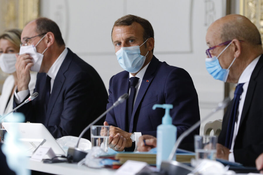 French President Emmanuel Macron, center, chairs a weekly cabinet meeting with Prime Minister Jean Castex, left, and Foreign Minister Jean-Yves le Drian, Wednesday, Aug.26, 2020 at the Elysee Palace in Paris. (AP Photo/Kamil Zihnioglu, Pool)