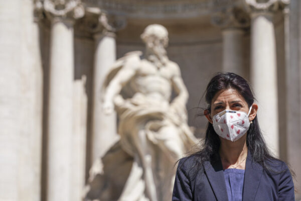 Rome’s Mayor Virginia Raggi attends a press conference to present a new electric scooters sharing service, in front of Rome’s Trevi Fountain, Thursday, May 28, 2020. Alternative means of transport are being promoted in Italy’s major metropolitan areas following public transports’ restrictions that have been set for containing the COVID-19 spread. (AP Photo/Andrew Medichini)