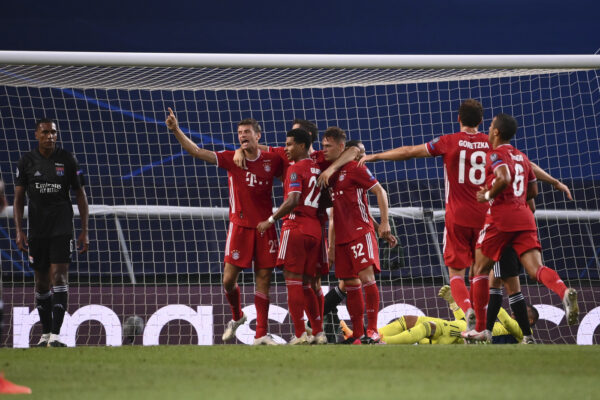Bayern’s Serge Gnabry celebrates with teammates after scoring his side’s second goal during the Champions League semifinal soccer match between Lyon and Bayern at the Jose Alvalade stadium in Lisbon, Portugal, Wednesday, Aug. 19, 2020. (Franck Fife/Pool via AP)