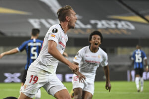 Sevilla’s Luuk de Jong celebrates after scoring his side’s second goal during the Europa League final soccer match between Sevilla and Inter Milan in Cologne, Germany, Friday, Aug. 21, 2020. (Ina Fassbender/Pool via AP)