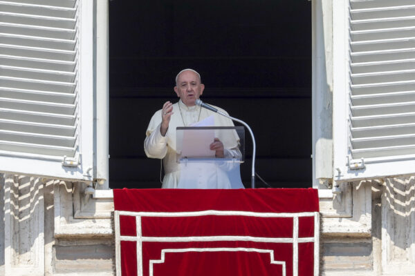 Pope Francis delivers his blessing as he recites the Angelus noon prayer from the window of his studio overlooking St.Peter’s Square, at the Vatican, Sunday, Sept. 13, 2020. (AP Photo/Andrew Medichini)
