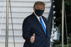 President Donald Trump gives thumbs up as he leaves the White House to go to Walter Reed National Military Medical Center after he tested positive for COVID-19, Friday, Oct. 2, 2020, in Washington. (AP Photo/Alex Brandon)