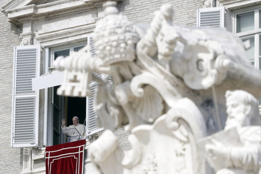 Pope Francis waves during the Angelus noon prayer delivered from his studio window overlooking St. Peter’s Square, at the Vatican, Sunday, Oct. 4, 2020. (AP Photo/Gregorio Borgia)
