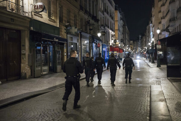 Police patrol in the streets as the curfew starts in Paris, Saturday, Oct. 17, 2020. French restaurants, cinemas and theaters are trying to figure out how to survive a new curfew aimed at stemming the flow of record new coronavirus infections. The monthlong curfew came into effect Friday at midnight, and France is deploying 12,000 extra police to enforce it. (AP Photo/Lewis Joly) Police patrol in the streets as the curfew starts in Paris, Saturday, Oct. 17, 2020. French restaurants, cinemas and theaters are trying to figure out how to survive a new curfew aimed at stemming the flow of record new coronavirus infections. The monthlong curfew came into effect Friday at midnight, and France is deploying 12,000 extra police to enforce it. (AP Photo/Lewis Joly)