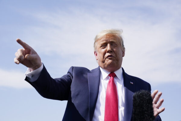 President Donald Trump talks to reporters at Phoenix Sky Harbor International Airport, Monday, Oct. 19, 2020, in Phoenix. (AP Photo/Alex Brandon)