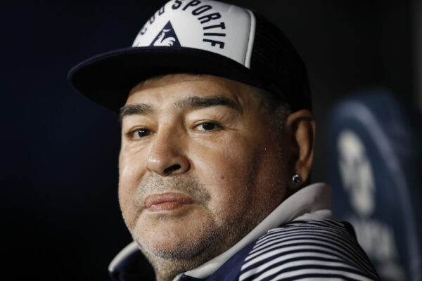 Gimnasia y Esgrima’s coach Diego Maradona seats on the bench prior to an Argentina’s soccer league match against Boca Juniors at La Bombonera stadium in Buenos Aires, Argentina, Saturday, March 7, 2020. (AP Photo/Natacha Pisarenko)