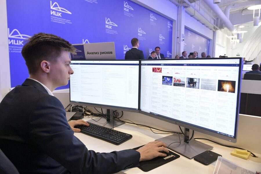 In this photo taken on Tuesday, March 17, 2020, An employee of a call center of the emergency response center on control and monitoring of the coronavirus disease, in Moscow, Russia. Russian authorities declared a war on "fake news" related to the new coronavirus. The crusade was triggered by what looked like a real disinformation campaign, but as the outbreak in Russia picked up speed and criticism of the Kremlin’s "it is under control" stance mounted, the authorities cracked down on social media users doubting the official numbers and news outlets questioning the government’s response to the epidemic. (Alexander Astafyev, Sputnik, Kremlin Pool Photo via AP)