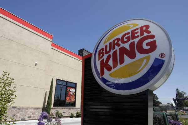 FILE – This April 25, 2019, file photo shows a Burger King in Redwood City, Calif. Burger King is announcing its work to help address a core industry challenge: the environmental impact of beef.  To help tackle this environmental issue, the Burger King brand partnered with top scientists to develop and test a new diet for cows, which according to initial study results, on average reduces up to 33% of cows’ daily methane emissions. (AP Photo/Jeff Chiu, File)