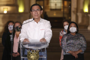 Peru’s President Martin Vizcarra speaks in front of the presidential palace after lawmakers voted to remove him from office in Lima, Peru, Monday, Nov. 9, 2020. Lawmakers voted to impeach Vizcarra, accusing him of taking bribes years ago and poorly handling the country’s response to the coronavirus pandemic. (AP Photo/Martin Mejia)