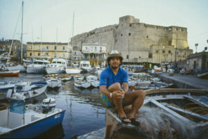 The Argentine footballer of Naples Diego Armando Maradona sitting on a boat at the marina of Borgo Marinaro. Naples, September 1986. (Photo by Barbara Rombi Serra/Mondadori Portfolio via Getty Images)