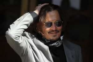 FILE – In this file photo dated Tuesday, July 28, 2020, US Actor Johnny Depp arrives at the High Court in London during his case against News Group Newspapers over a story published about his former wife Amber Heard, which branded him a ‘wife beater’.  A British judge is set to deliver his judgement in writing on Monday Nov. 2, 2020, deciding whether a tabloid newspaper defamed Depp by calling him a “wife beater.”  (AP Photo/Frank Augstein, FILE)