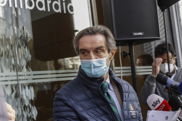 Lombardy region governor Attilio Fontana speaks during a news conference outside the Lombardy region headquarters, in Milan, Italy, Thursday, Nov. 5, 2020. Lombardy, along with three other Italian regions, was included by government in the so-called red zones, where a stricter lockout is mandatory because of the diffusion of COVID-19 pandemic. (AP Photo/Luca Bruno)
