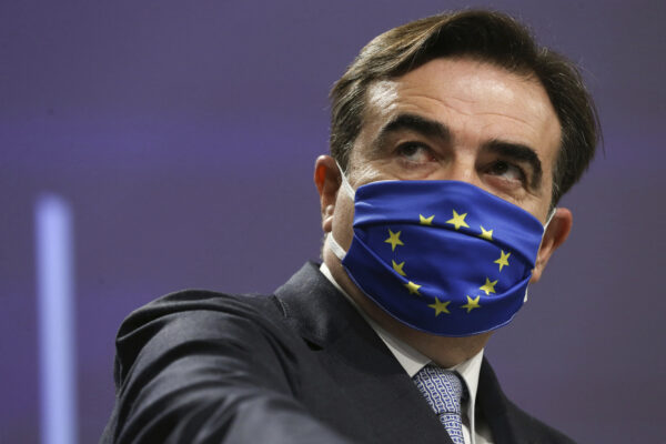 European Commission Vice-President Margaritis Schinas wears a protective face mask prior to speaking during a live streamed press conference at EU Headquarters in Brussels, Friday, Nov. 27, 2020. The EU chaired on Monday the 15th annual high-level meeting with religious leaders, gathering eight representatives of religious organizations from across Europe. (Francois Walschaerts, Pool via AP)