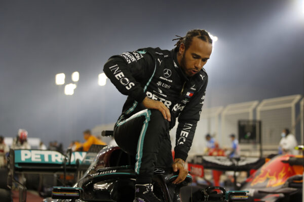 Mercedes driver Lewis Hamilton of Britain exits his car after wining the Formula One race in Bahrain International Circuit in Sakhir, Bahrain, Sunday, Nov. 29, 2020. (Hamad Mohammed, Pool via AP)