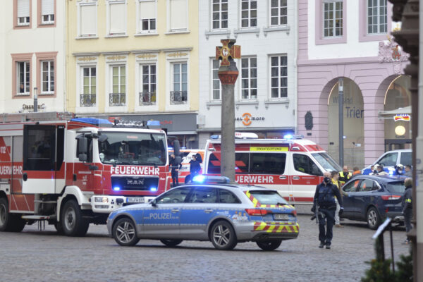 A square is blocked by the police in Trier, Germany, Tuesday, Dec. 1, 2020.  German police say two people have been killed and several others injured in the southwestern German city of Trier when a car drove into a pedestrian zone. Trier police tweeted that the driver had been arrested and the vehicle impounded. (Harald Tittel/dpa via AP)