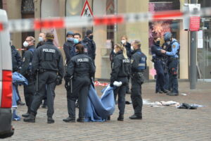 A street is blocked by the police in Trier, Germany, Tuesday, Dec. 1, 2020.  German police say people have been killed and several others injured in the southwestern German city of Trier when a car drove into a pedestrian zone. Trier police tweeted that the driver had been arrested and the vehicle impounded. (Harald Tittel/dpa via AP)