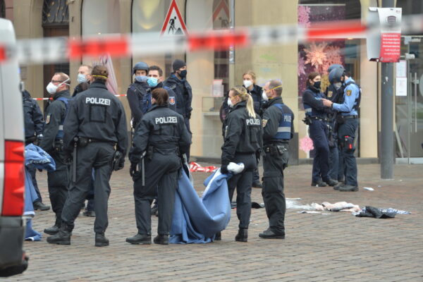 A street is blocked by the police in Trier, Germany, Tuesday, Dec. 1, 2020.  German police say people have been killed and several others injured in the southwestern German city of Trier when a car drove into a pedestrian zone. Trier police tweeted that the driver had been arrested and the vehicle impounded. (Harald Tittel/dpa via AP)