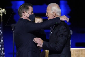 President-elect Joe Biden, right, embraces his son Hunter Biden, left, Saturday, Nov. 7, 2020, in Wilmington, Del. (AP Photo/Andrew Harnik, Pool)