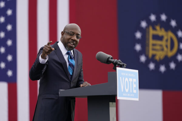 Georgia Democratic candidate for U.S. Senate Raphael Warnock speaks during a drive-in rally Tuesday, Dec. 15, 2020, in Atlanta. (AP Photo/Patrick Semansky)