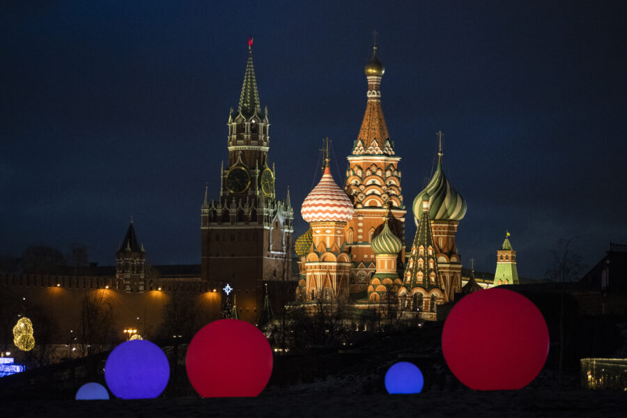 St. Basil Cathedral, right, and Kremlin’s Spasskaya Tower illuminated as light balls are installed for New Year and Christmas celebrations in Zaryadye Park in Moscow, Russia, Wednesday, Dec. 23, 2020. (AP Photo/Pavel Golovkin)