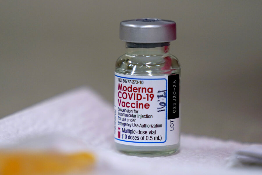 A bottle of Moderna’s COVID-19 vaccine is seen on a table before Kansas Democratic Gov. Laura Kelly received an injection Wednesday, Dec. 30, 2020, in Topeka, Kan. (AP Photo/Charlie Riedel)