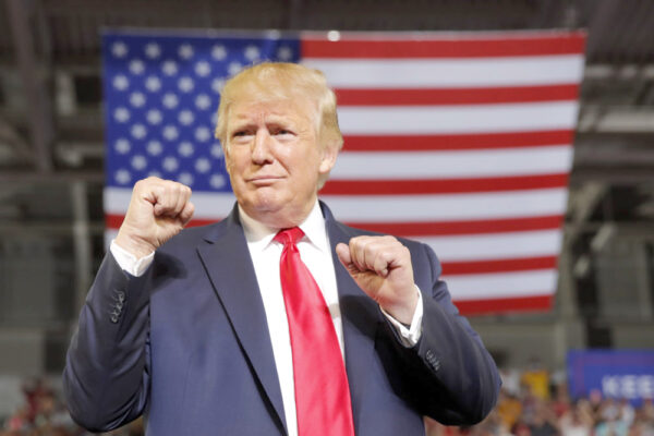 In this July 17, 2019, photo, President Donald Trump arrives to speak at a campaign rally at Williams Arena in Greenville, N.C. (AP Photo/Carolyn Kaster)